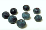 Lower cholesterol naturally by eating berries: Photo of blueberries.