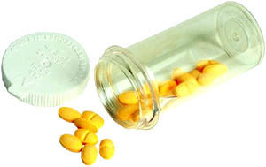 Understanding cholesterol meds: Picture of a bottle of pills.